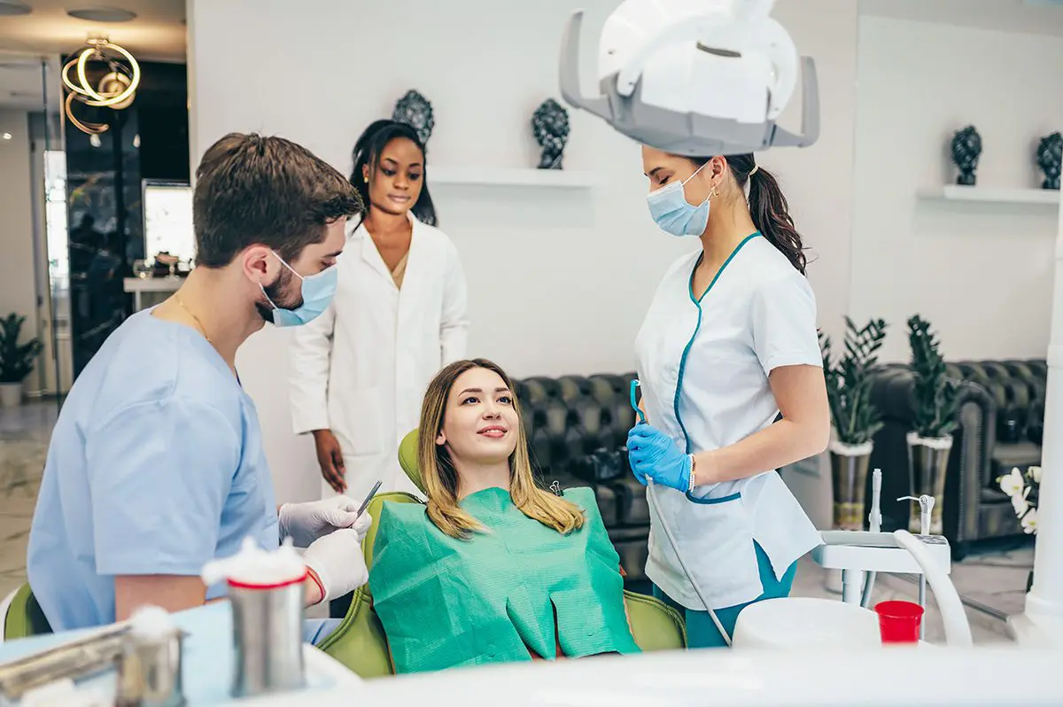 2woman-patient-in-dental-clinic-being-examined-by-a-2023-11-27-05-09-59-utc
